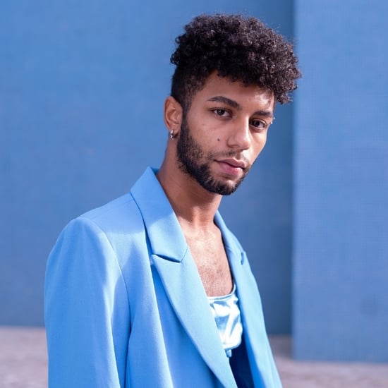 young black male model in light blue suit 