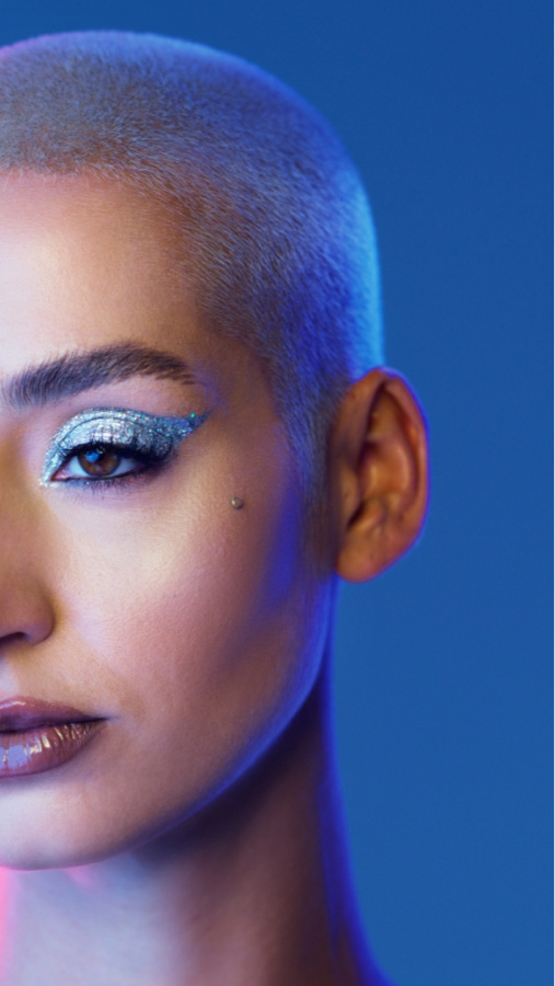 Buzzcut woman with blue eyeshadow