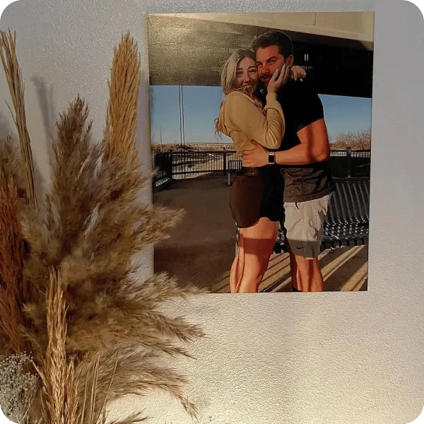 An image of a couple printed on canvas, hanging on the wall