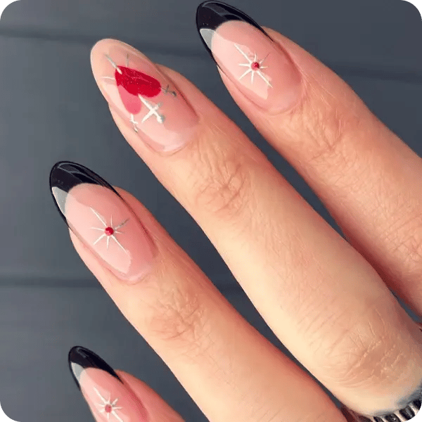 Red and black nails with a small heart and stars done by Pure Nails