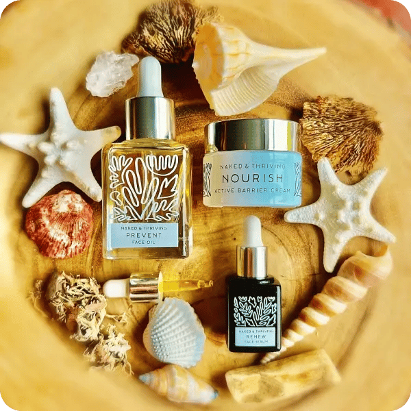 Naked &amp; Thriving products laid out between shells