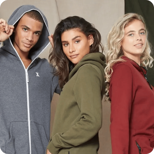 A man in a navy, a woman in an olive green and another woman in a red cotton Onepiece
