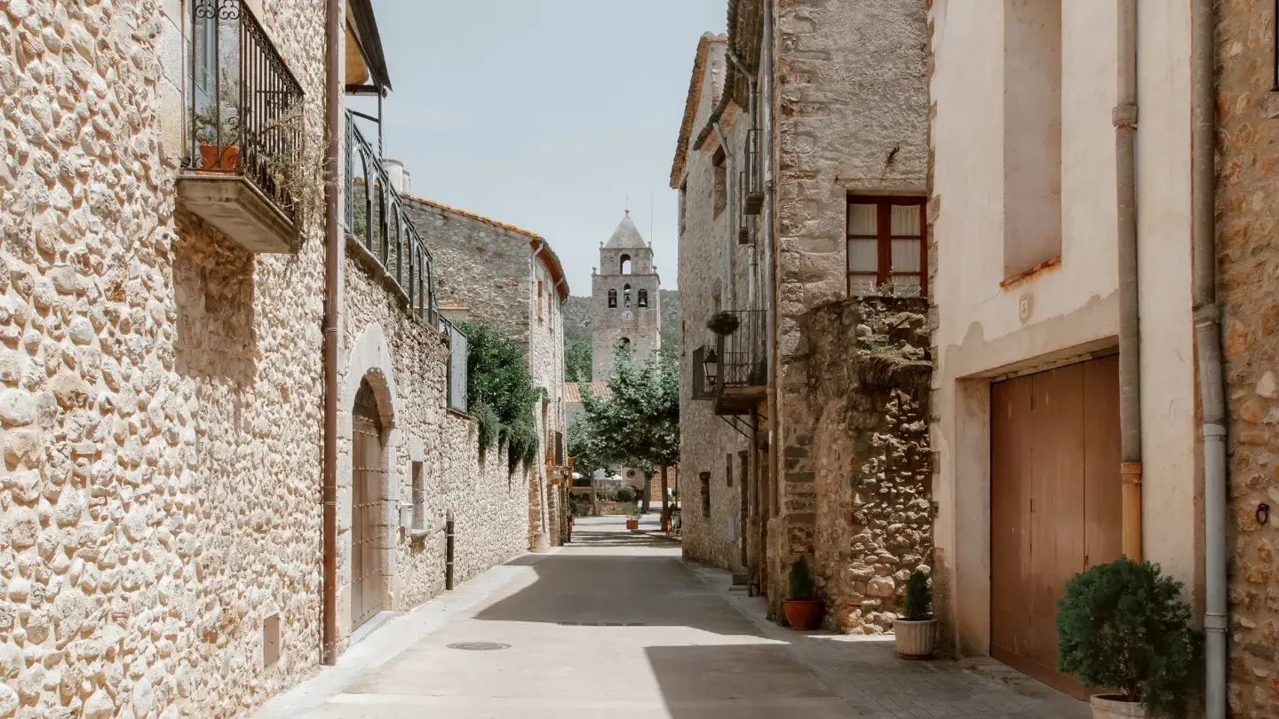 streets of italy with an image of brick houses on each side